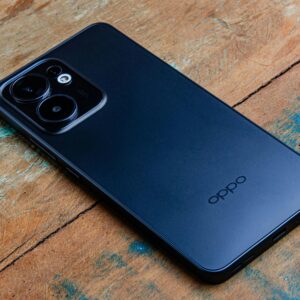 A sleek smartphone placed on a rustic wooden surface, showcasing a modern design.